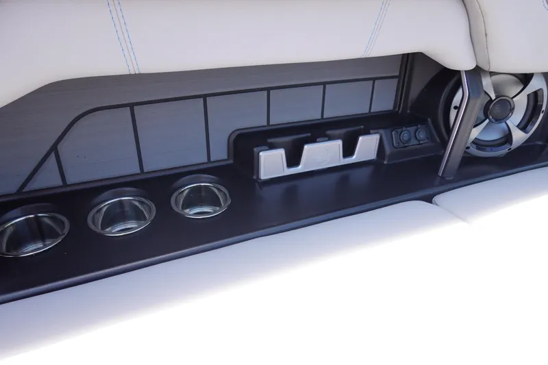 Slide: The Image of 2021 Malibu Wakesetter 25 LSV interior with cup holders and speaker system. - 27