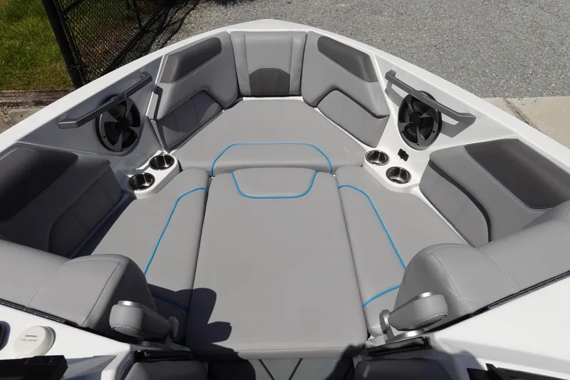 Slide: The Image of Interior of 2021 Malibu Wakesetter 25 LSV boat with gray seating and cup holders. - 32