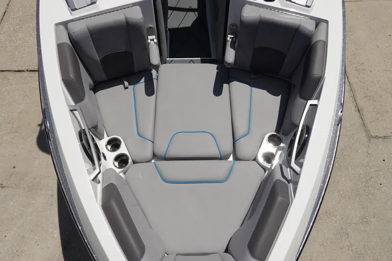 Slide: The Image of 2021 Malibu Wakesetter 25 LSV boat interior with gray seating and cup holders. - 33