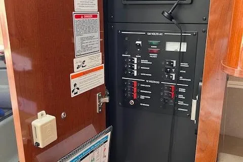 Slide: The Image of Electrical panel inside 2011 Sea Ray 280 Sundancer boat cabin. - 19