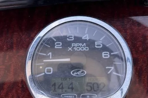 Slide: The Image of Tachometer of 2011 Sea Ray 280 Sundancer showing RPM and engine hours. - 20