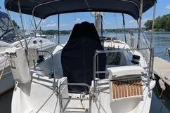 Slide: The Image of Sailboat docked at marina, 1992 Hunter 33.5 model, with covered cockpit and canopy. - 5