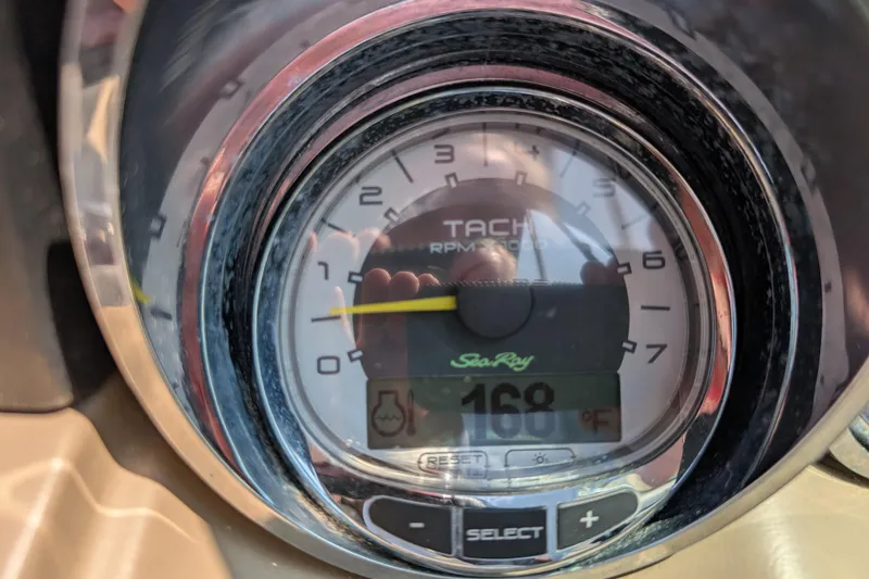 Slide: The Image of Tachometer of 2009 Sea Ray 280 Sundeck showing 168°F temperature reading. - 13