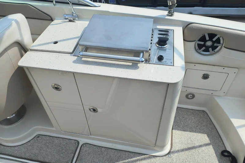 Slide: The Image of 2009 Sea Ray 280 Sundeck boat interior with built-in grill and sink. - 6