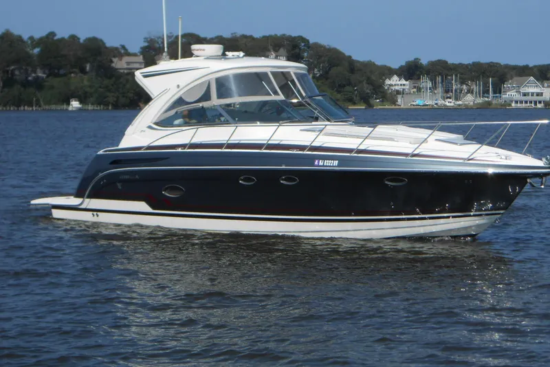 The Image of 2017 Formula 37 PC yacht cruising on a calm lake with scenic background. - 0