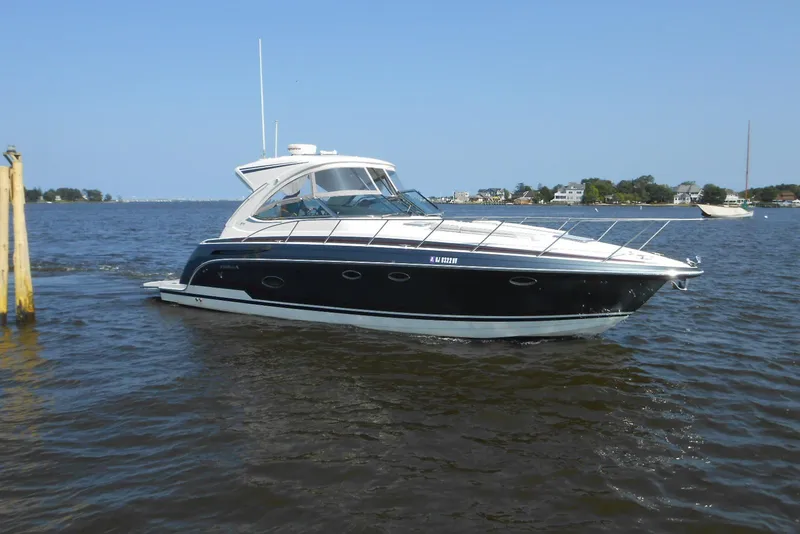 Slide: The Image of 2017 Formula 37 PC yacht cruising on a calm lake under clear blue skies. - 1