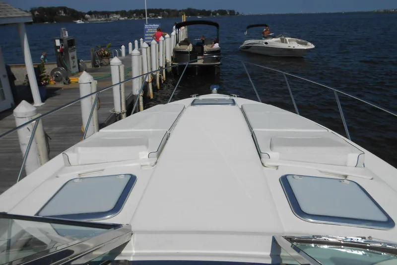 Slide: The Image of 2017 Formula 37 PC yacht docked at marina with scenic water view. - 11