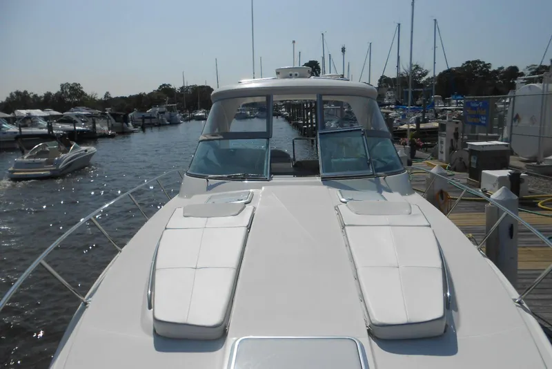 Slide: The Image of 2017 Formula 37 PC yacht docked at marina, featuring spacious deck and sleek design. - 12