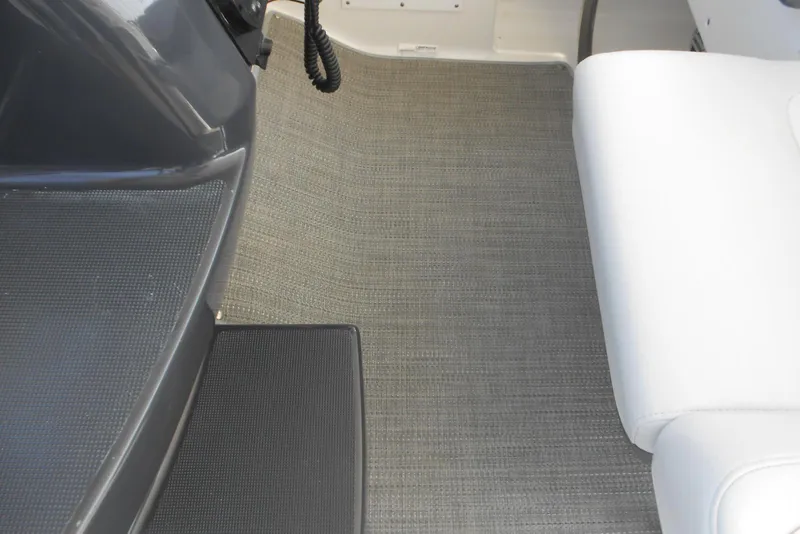 Slide: The Image of 2017 Formula 37 PC boat interior with gray flooring and white seating. - 14