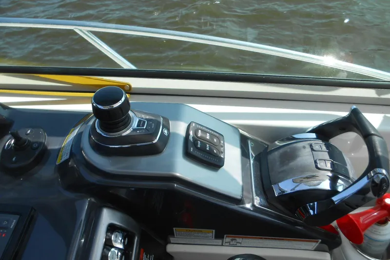 Slide: The Image of Control panel of a 2017 Formula 37 PC boat with joystick and throttle. - 18