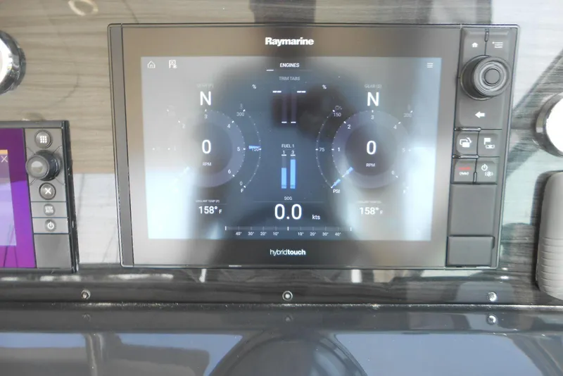 Slide: The Image of Raymarine display on 2017 Formula 37 PC showing engine data and navigation metrics. - 19
