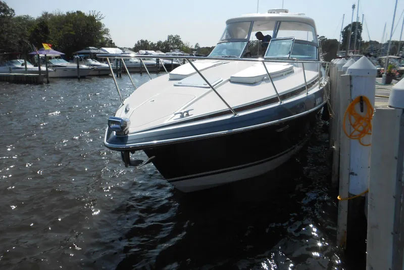 Slide: The Image of 2017 Formula 37 PC yacht docked at marina, surrounded by water and other boats. - 2