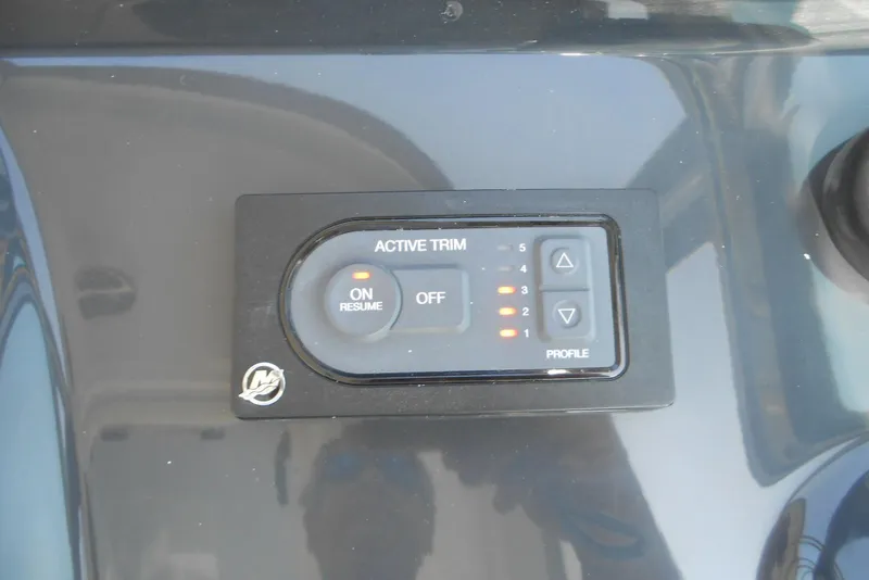 Slide: The Image of Active trim control panel on 2017 Formula 37 PC boat dashboard. - 24