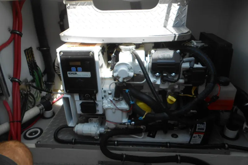 Slide: The Image of Engine compartment of a 2017 Formula 37 PC boat, featuring Kohler generator. - 33