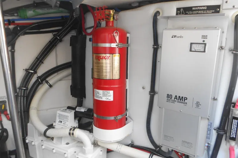 Slide: The Image of Engine room of 2017 Formula 37 PC with fire extinguisher and battery charger. - 34