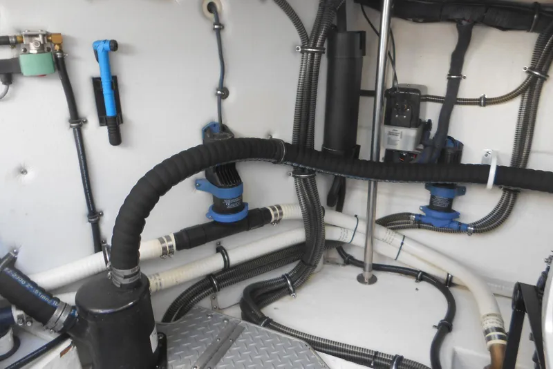 Slide: The Image of Engine room of a 2017 Formula 37 PC boat with hoses and equipment. - 35