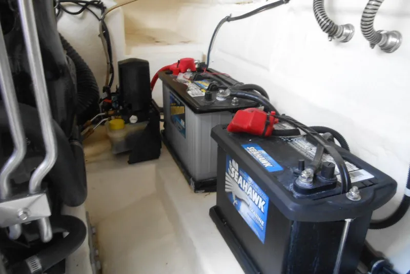 Slide: The Image of 2017 Formula 37 PC boat engine compartment with marine batteries and wiring. - 37