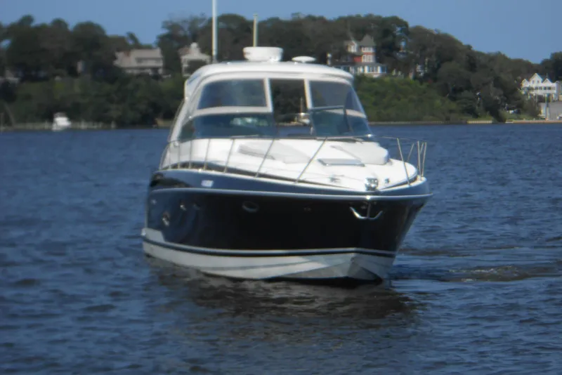 Slide: The Image of 2017 Formula 37 PC yacht cruising on a serene lake with scenic background. - 4