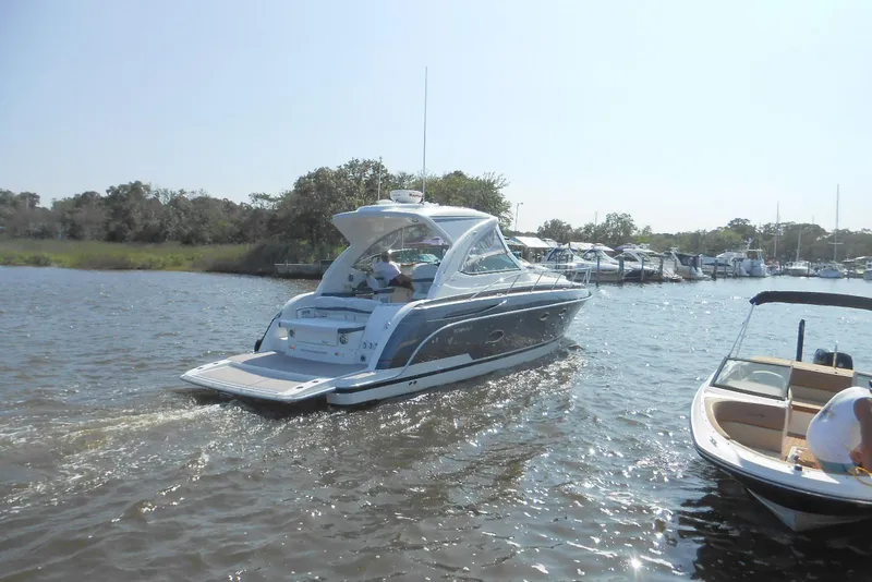 Slide: The Image of 2017 Formula 37 PC yacht cruising on a sunny day near a marina. - 6