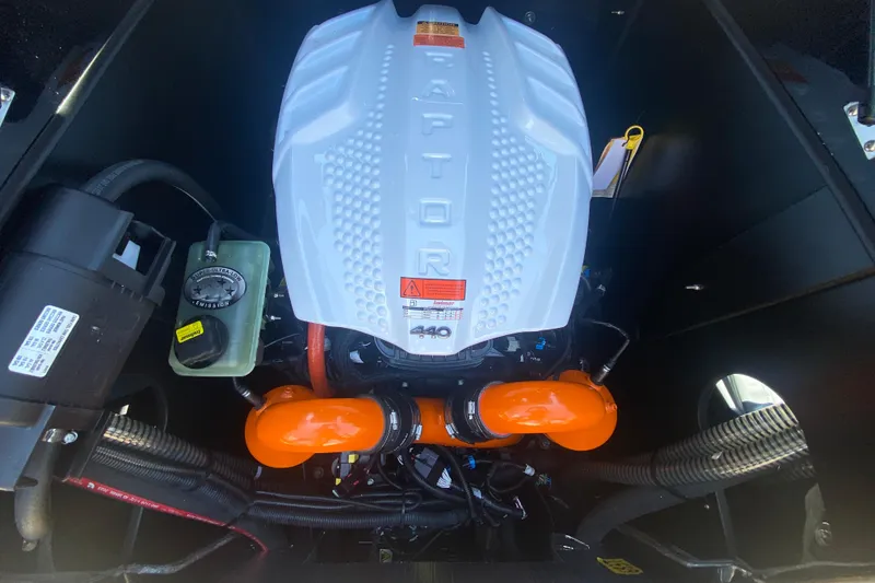Slide: The Image of 2023 Tigé 23ZX boat engine, featuring a Raptor 440 with orange components. - 11