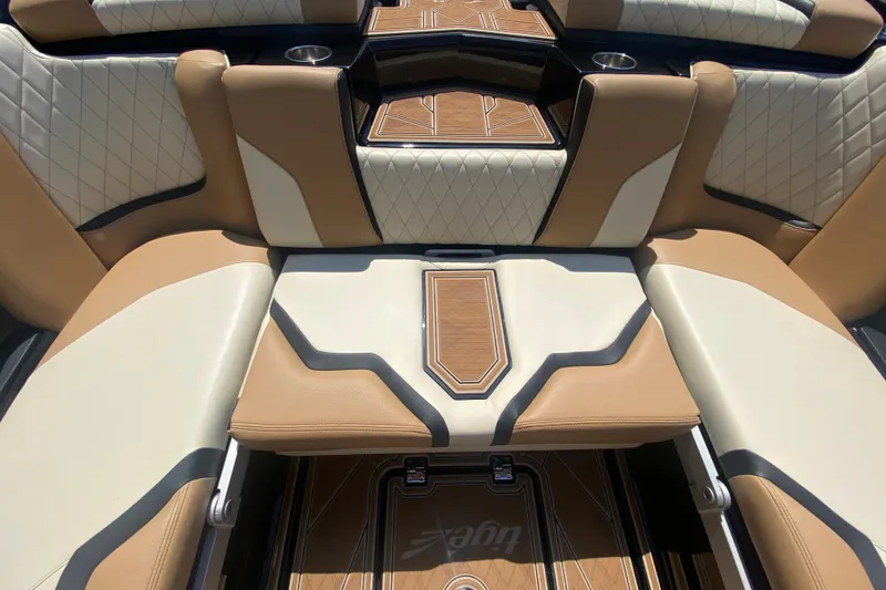 Slide: The Image of 2023 Tigé 23ZX boat interior with tan and white leather seating. - 16