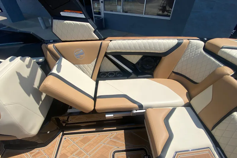Slide: The Image of 2023 Tigé 23ZX boat interior with luxurious tan and cream seating. - 21