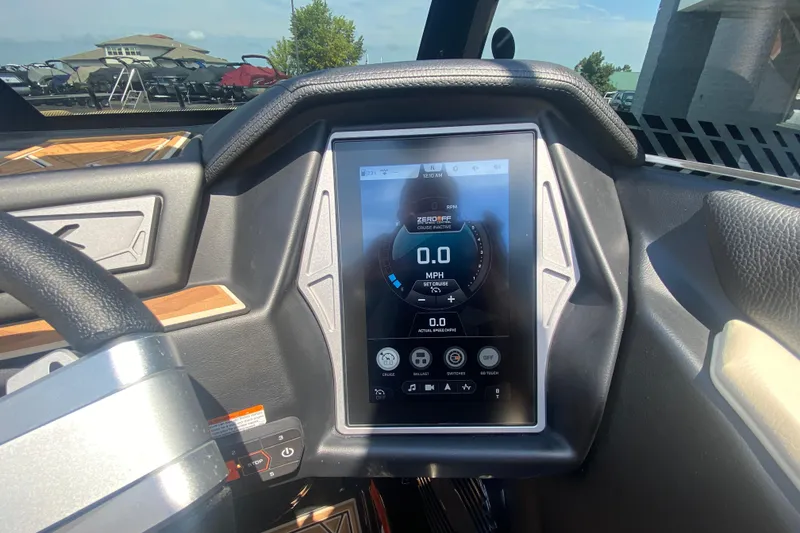 Slide: The Image of 2023 Tigé 23ZX dashboard with touchscreen display showing speed and controls. - 26