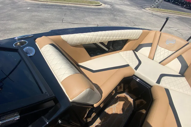 Slide: The Image of 2023 Tigé 23ZX boat interior with luxurious tan and cream seating. - 30