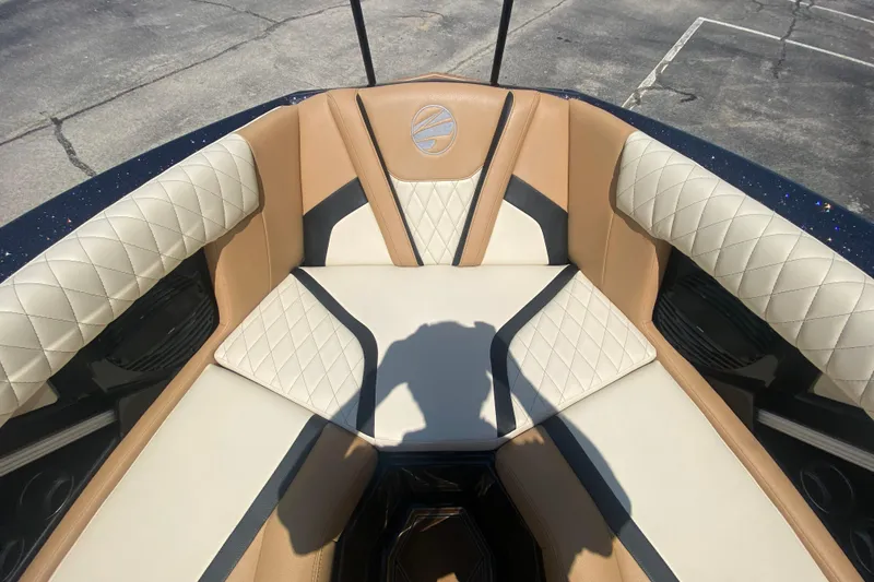 Slide: The Image of 2023 Tigé 23ZX boat interior with luxurious tan and cream diamond-stitched seating. - 31