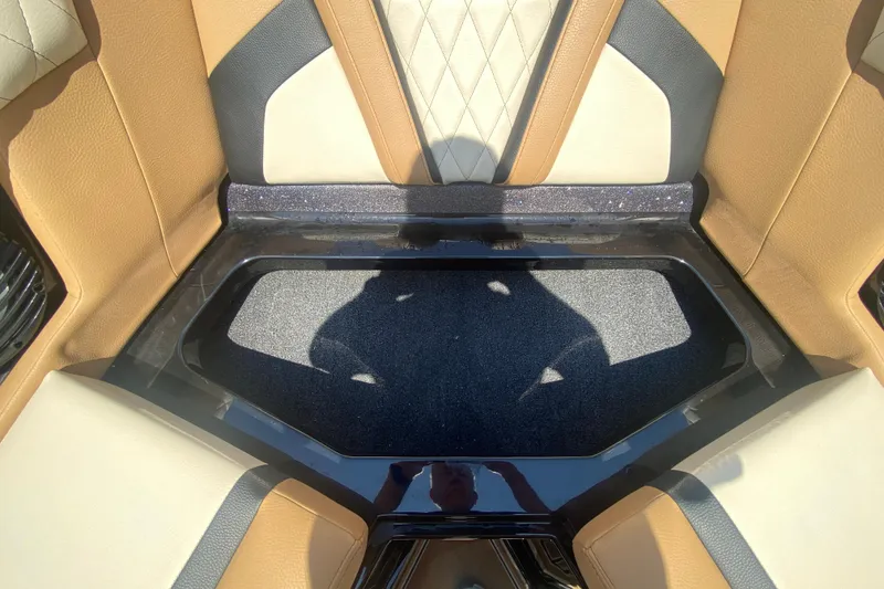 Slide: The Image of 2023 Tigé 23ZX boat interior with tan and black seating, diamond stitching. - 32