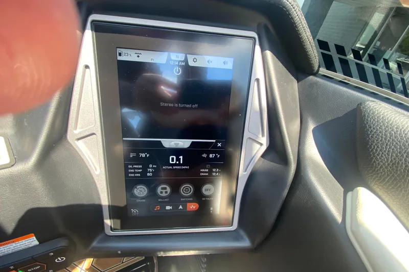 Slide: The Image of Touchscreen display in 2023 Tigé 23ZX boat showing controls and settings. - 33