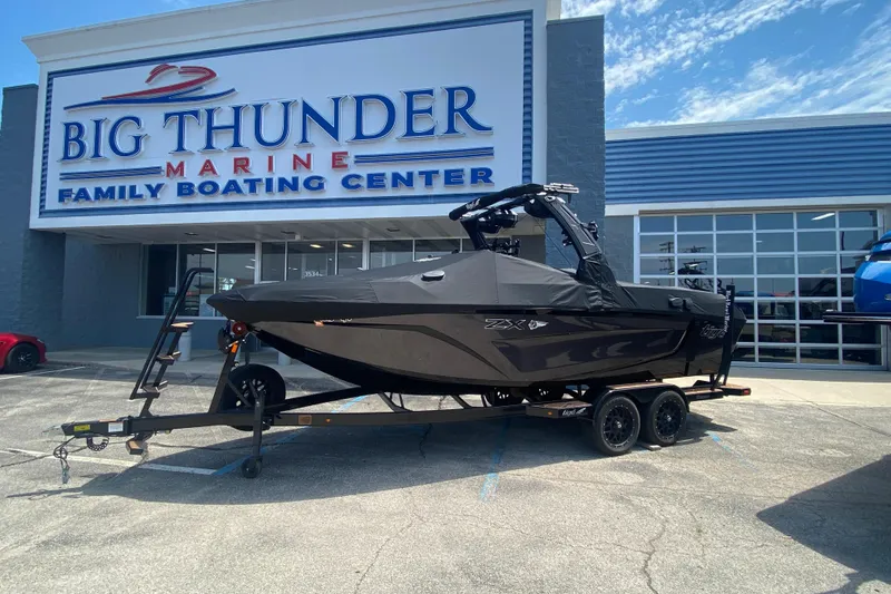 Slide: The Image of 2023 Tigé 23ZX boat on trailer at Big Thunder Marine dealership. - 41