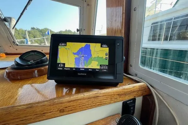 Slide: The Image of Garmin GPS on 1988 Ellis HARDTOP CRUISER boat dashboard, displaying navigation map. - 11