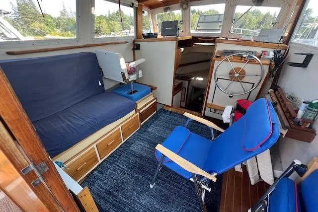 Slide: The Image of 1988 Ellis HARDTOP CRUISER interior with blue seating, wooden accents, and steering wheel. - 18