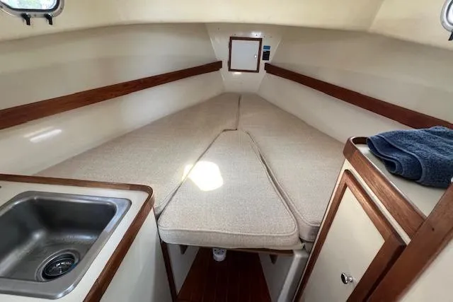 Slide: The Image of 1988 Ellis HARDTOP CRUISER interior with cozy cabin, sink, and wooden accents. - 22