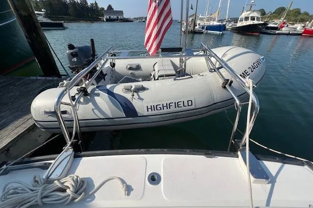 Slide: The Image of 1988 Ellis HARDTOP CRUISER with Highfield inflatable boat docked in a marina. - 4