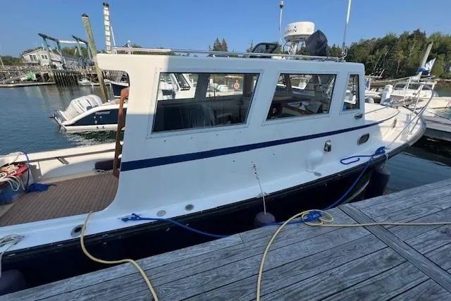 Slide: The Image of 1988 Ellis HARDTOP CRUISER docked at marina, side view with clear sky. - 7