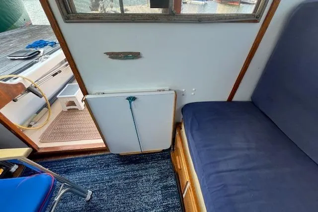 Slide: The Image of Interior of 1988 Ellis HARDTOP CRUISER with blue seating and nautical decor. - 8