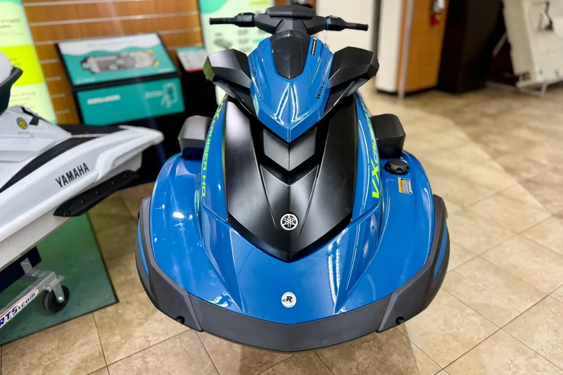 Slide: The Image of 2025 Yamaha WaveRunner VX Cruiser HO with Audio, blue, displayed indoors on tiled floor. - 2