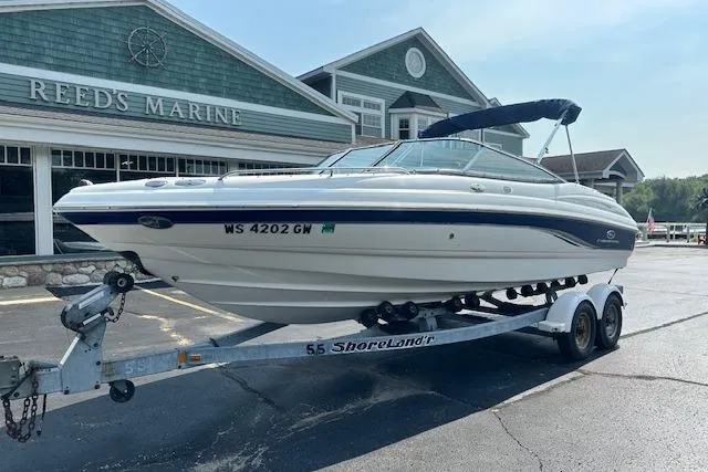 The Image of 2005 Chaparral 210 SSi boat on trailer at Reeds Marine dealership. - 0