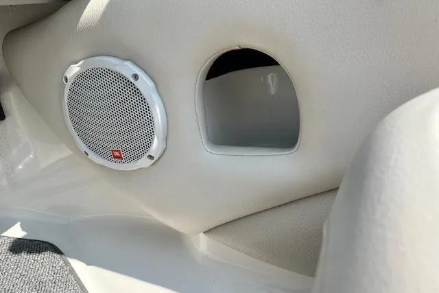 Slide: The Image of Speaker and storage compartment in 2005 Chaparral 210 SSi boat interior. - 11