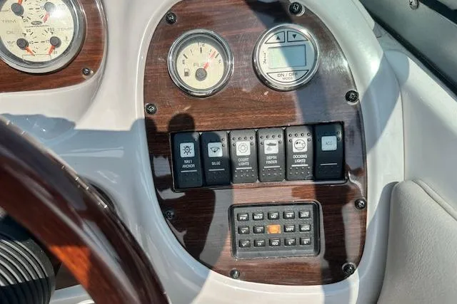 Slide: The Image of Dashboard of 2005 Chaparral 210 SSi boat with gauges and control switches. - 12