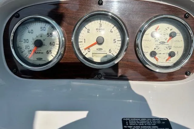 Slide: The Image of Dashboard of a 2005 Chaparral 210 SSi boat with speedometer and gauges. - 13
