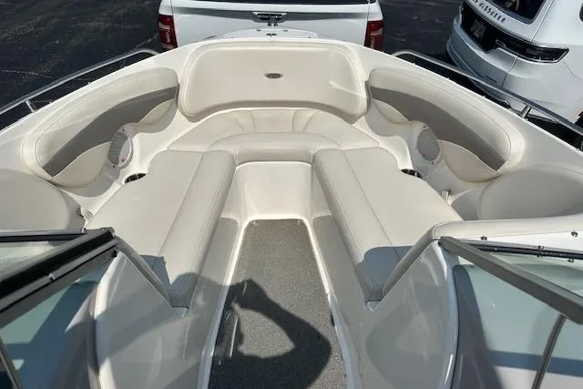 Slide: The Image of 2005 Chaparral 210 SSi boat interior with white seating and carpeted floor. - 16
