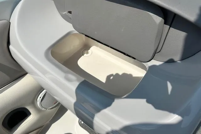 Slide: The Image of 2005 Chaparral 210 SSi boat interior storage compartment with speaker detail. - 23