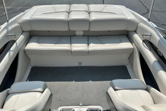 Slide: The Image of 2005 Chaparral 210 SSi boat interior with plush seating and carpeted flooring. - 26
