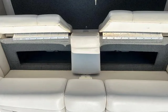 Slide: The Image of 2005 Chaparral 210 SSi boat interior seating with storage compartments. - 27