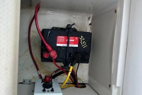 Slide: The Image of 2005 Chaparral 210 SSi boat battery compartment with wiring and connections. - 29