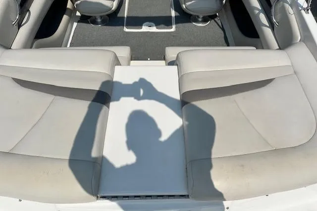 Slide: The Image of 2005 Chaparral 210 SSi boat interior with seating and shadow reflection. - 6