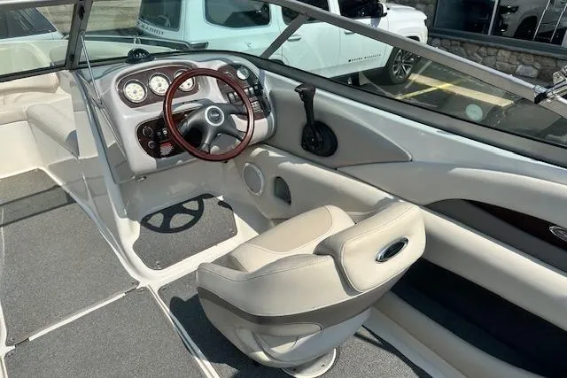 Slide: The Image of 2005 Chaparral 210 SSi boat interior with steering wheel and dashboard controls. - 7